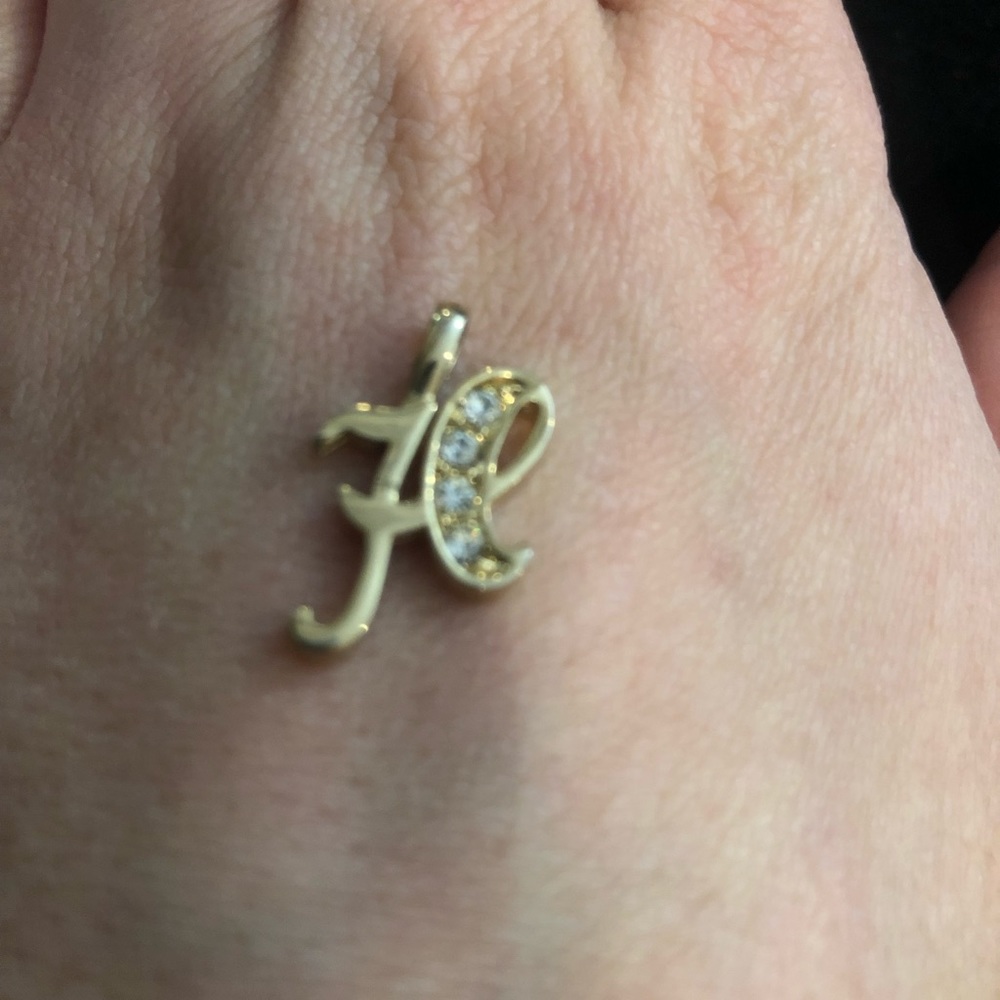 H charm.  Gold look and stones